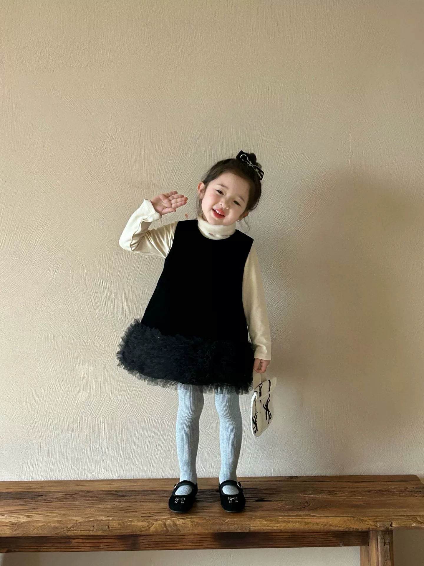 Black ruffle dress with high collar shirt