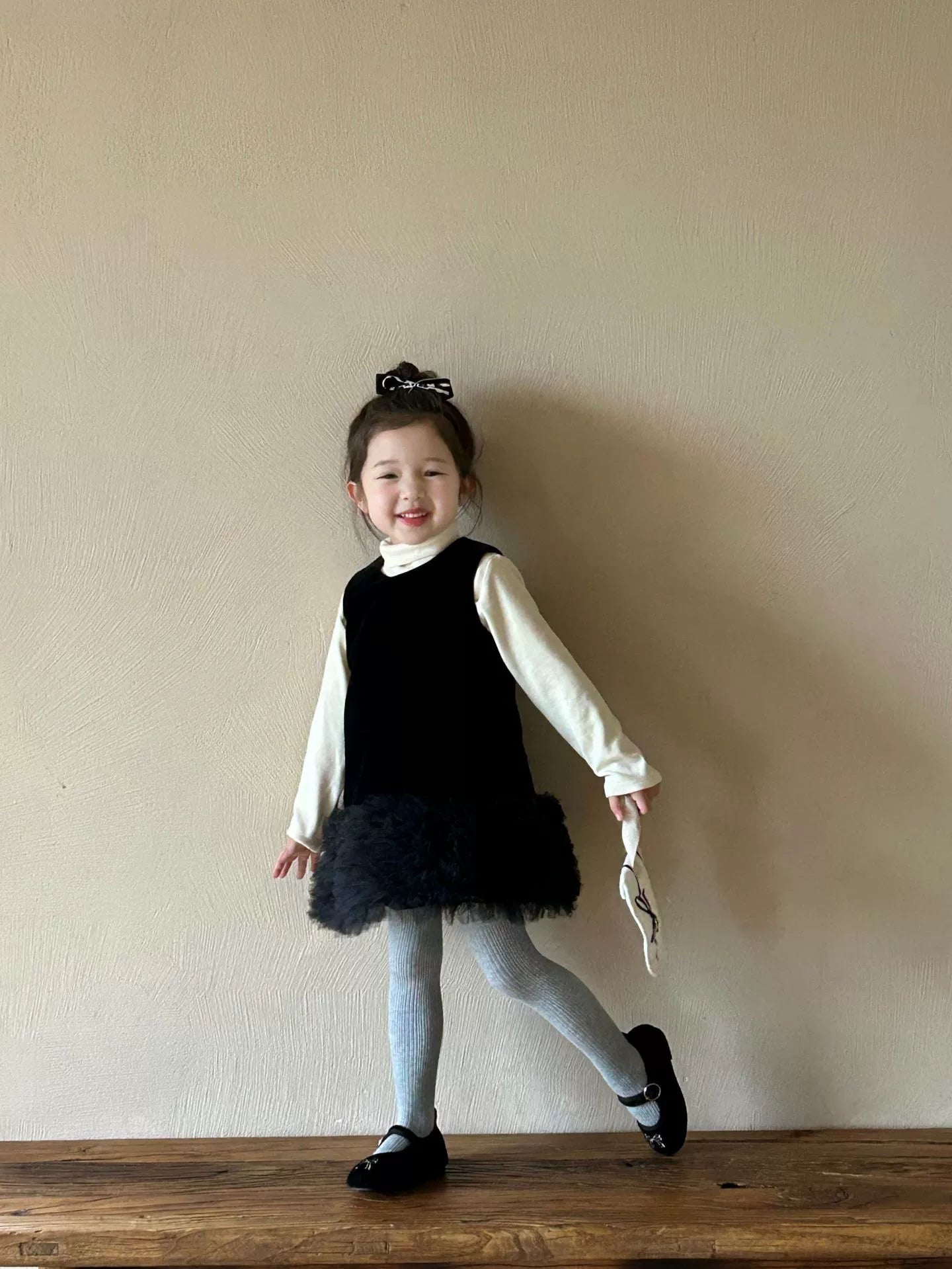 Black ruffle dress with high collar shirt