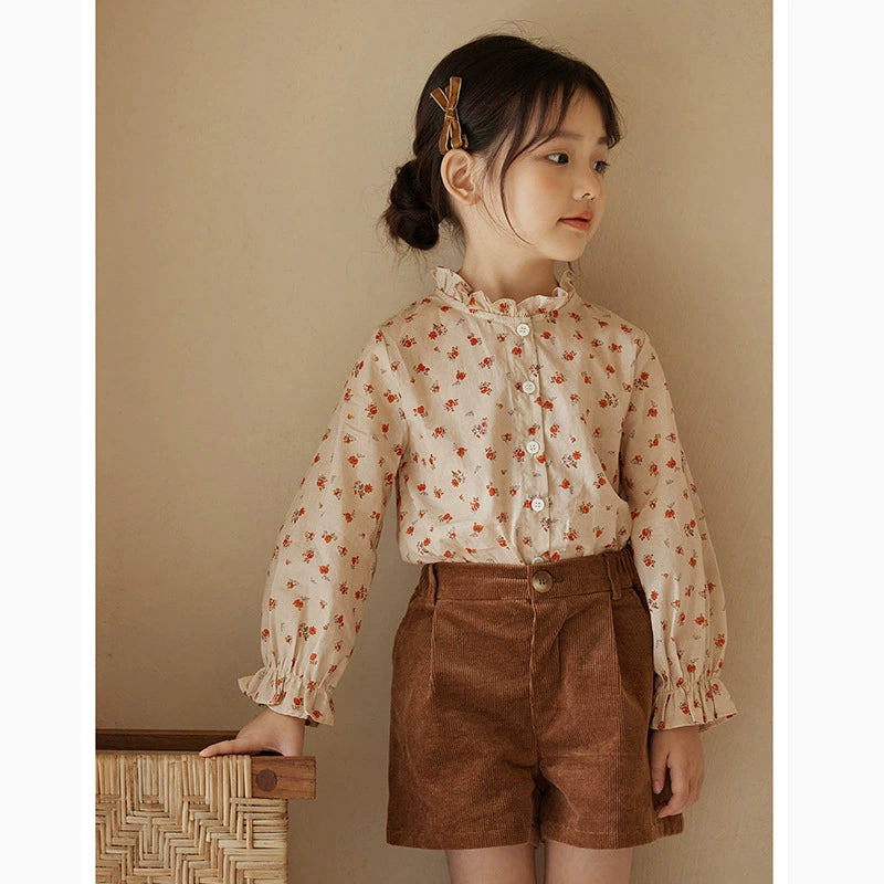 Floral shirt + brown shorts