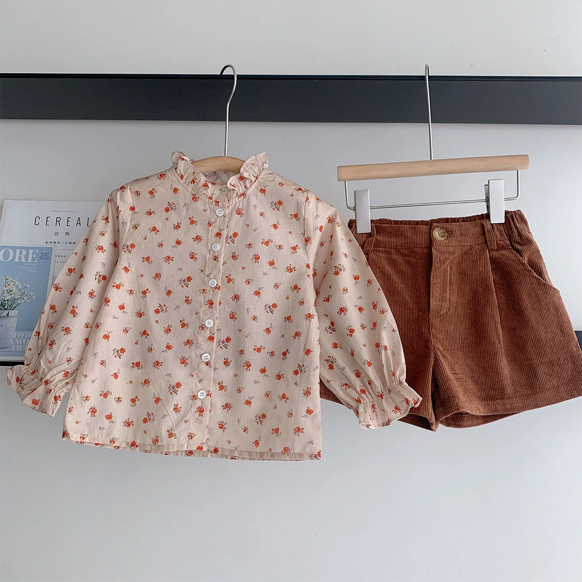 Floral shirt + brown shorts