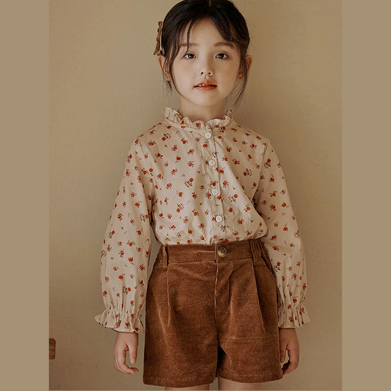 Floral shirt + brown shorts