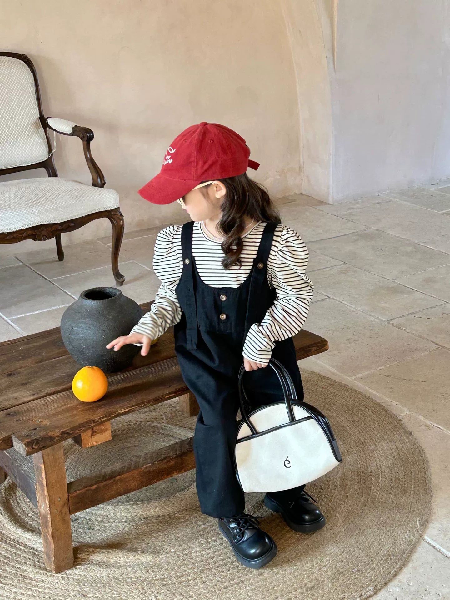 Black overall and stripe shirt